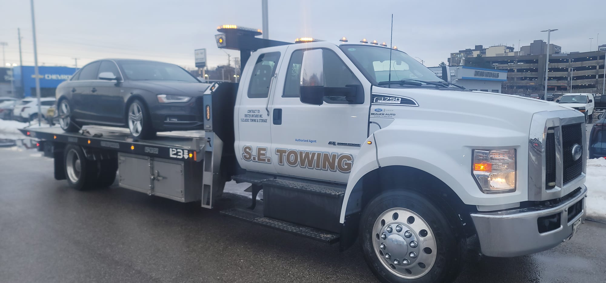 Chevrolet Silverado EV electric pickup on S.E. Towing flatbed in winter