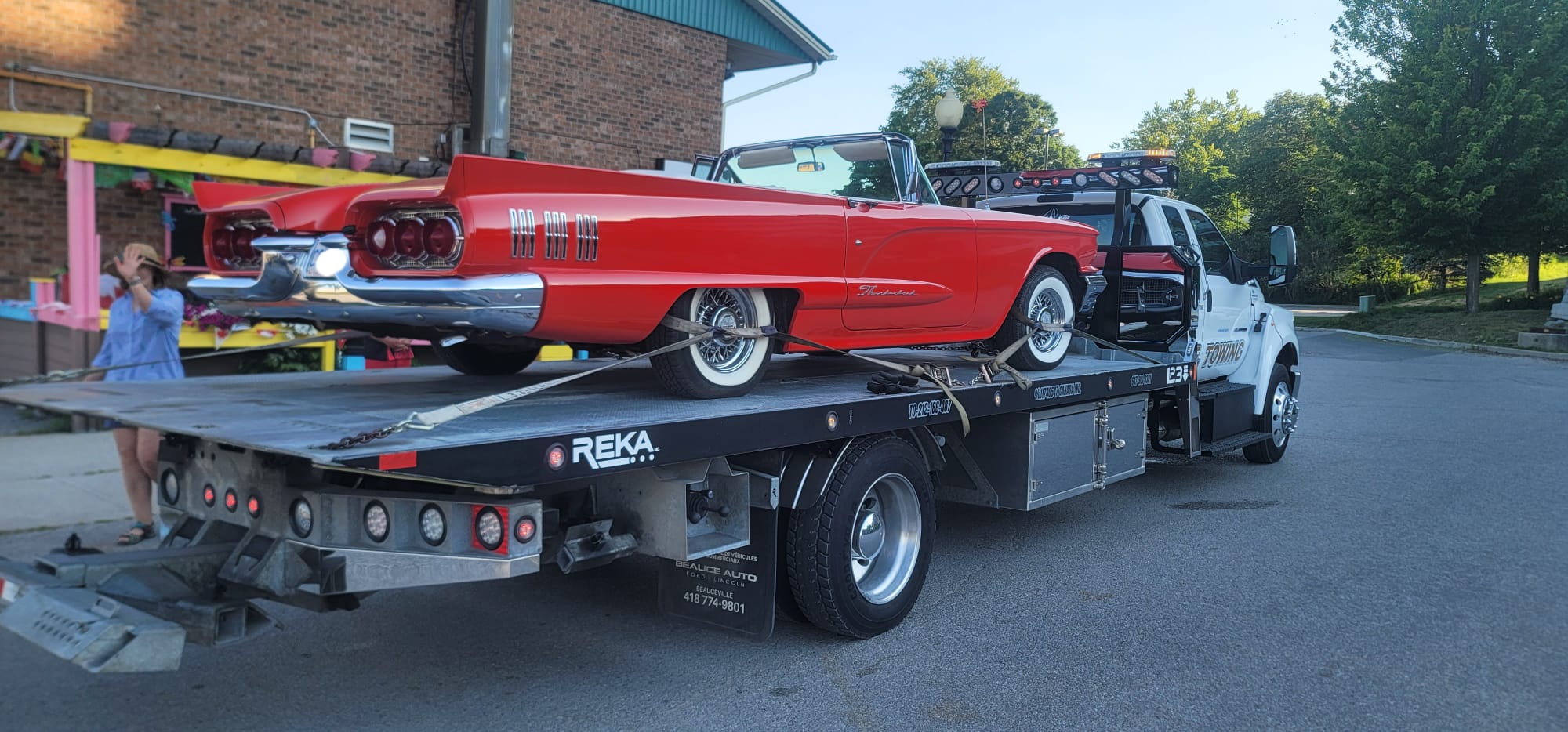Classic red Ford Thunderbird convertible safely transported on S.E. Towing flatbed